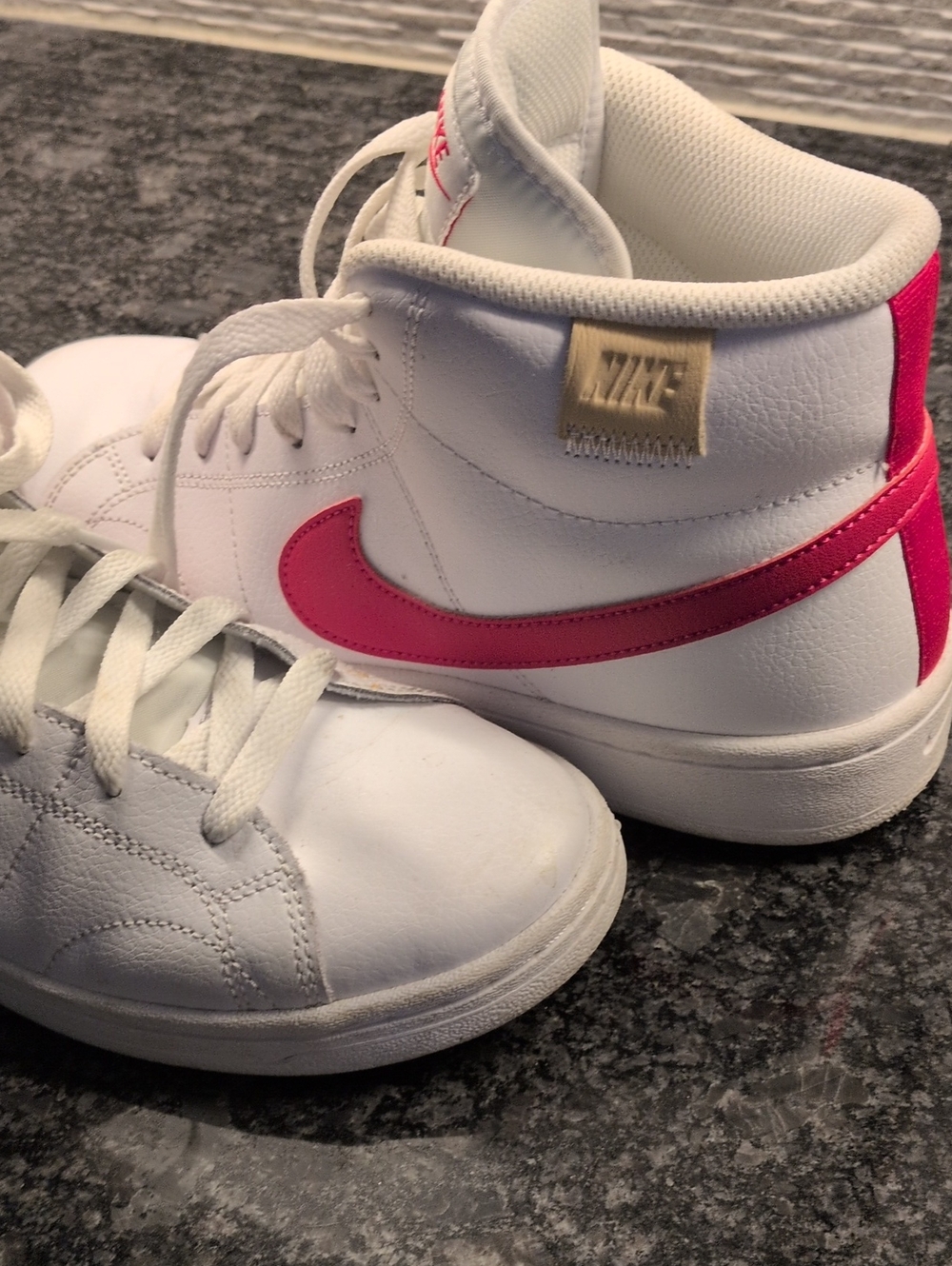 Women's Nike White High-Top Sneakers with Pink Swoosh